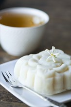 Close up of jasmine tea and rice cake