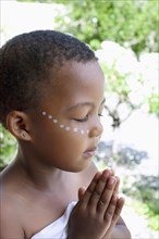 Mixed race girl praying