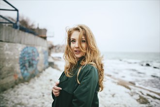 Portrait of smiling Caucasian woman on beach