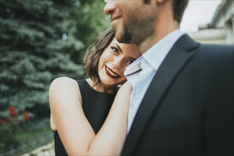 Portrait of smiling Caucasian couple hugging