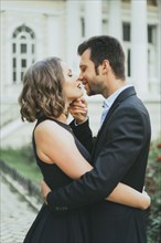 Portrait of smiling Caucasian couple kissing