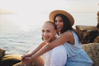 Portrait of smiling Caucasian couple at ocean