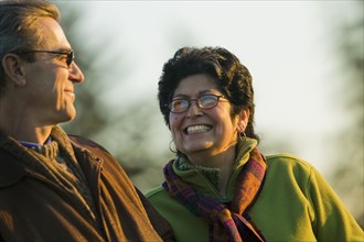 Hispanic couple smiling outdoors