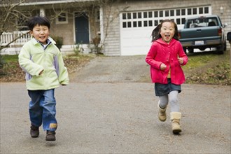 Korean children running in street