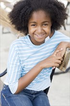 Cape Verdean girl smiling outdoors