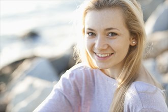 Caucasian teenage girl smiling outdoors