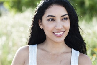 Hispanic woman smiling outdoors