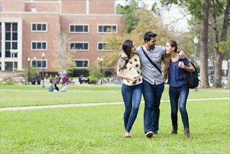 Smiling students walking on campus