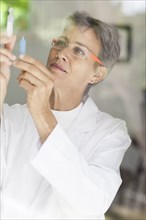 Close up of doctor examining vials