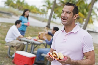 Hispanic friends enjoying barbecue