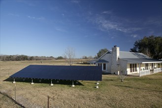 Solar panels outside home in rural landscape