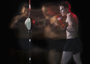 Blurred view of Caucasian boxer training