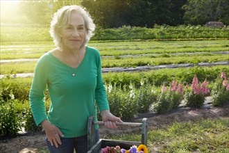 Older Caucasian woman smiling on farm