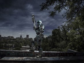 Robot patrolling city holding rifle