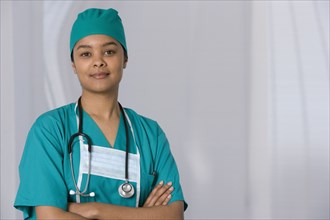 African female doctor with arms crossed
