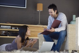 Asian couple working at home