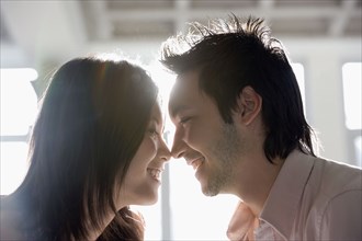 Asian couple touching noses