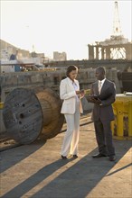 African American businesspeople on commercial pier