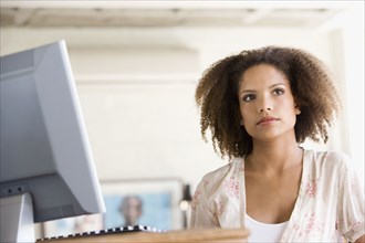 African businesswoman next to computer