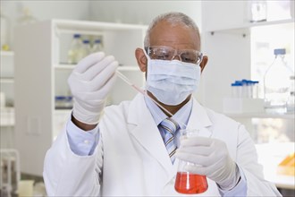 African scientist performing analysis in laboratory