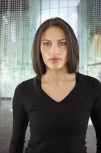 Mixed race woman in urban building