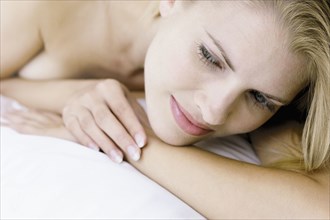 Close up of woman laying on bed
