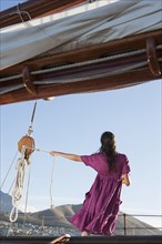 Caucasian woman on sailboat