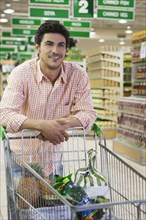 Caucasian man shopping in grocery store