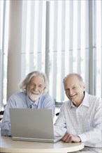 Senior Caucasian businessmen working together in office