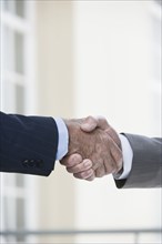 Caucasian businessmen shaking hands