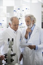 Senior Caucasian scientists working in lab