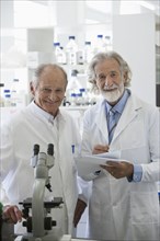 Senior Caucasian scientists working in lab