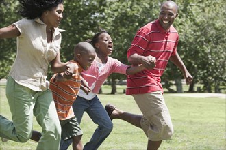 Family running together in park