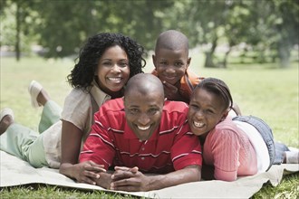 Family relaxing together in park