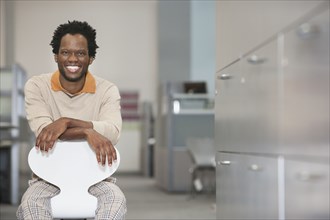 African American businessman smiling in office