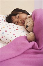 Chinese girl sleeping in bed