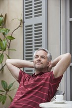 Man relaxing on porch