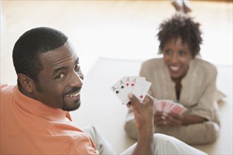 African American couple playing cards