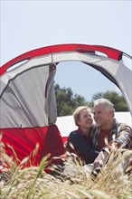 Senior Caucasian couple relaxing at campsite