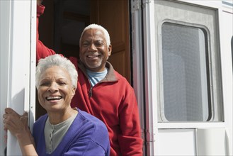 Mixed race Senior couple smiling in RV