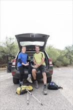 Portrait of hikers sitting in car