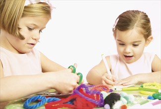 Young girls doing arts and crafts