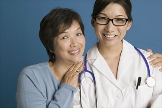 Doctor posing for the camera with her mother