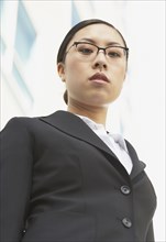 Low angle view of Asian businesswoman outdoors