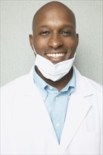 African male dentist smiling