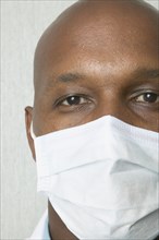 Close up of African man wearing surgical mask