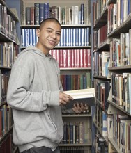 Young Asian man in library