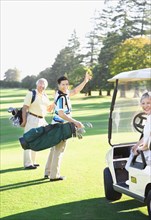 Asian family on golf course
