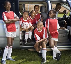 Multi-ethnic children in soccer uniforms