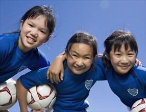 Multi-ethnic girls with soccer ball